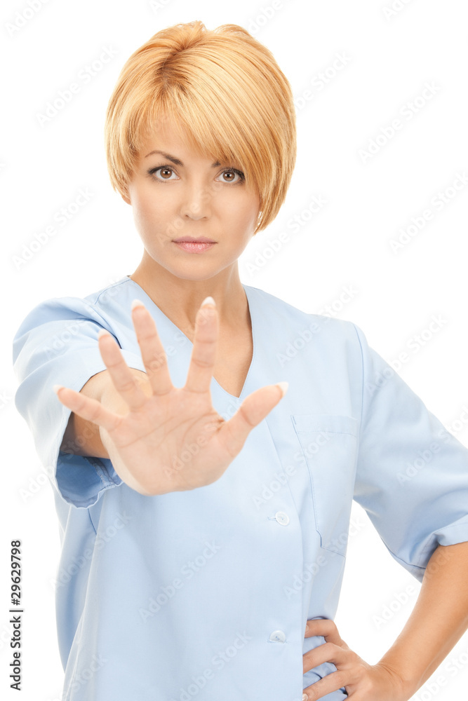 attractive female doctor showing stop gesture attractive female doctor showing stop gesture
