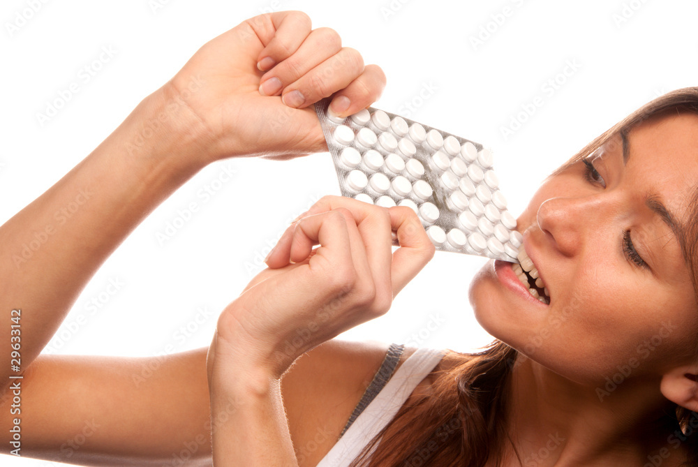 Obraz premium Woman bite the pack of medicine aspirin tablets