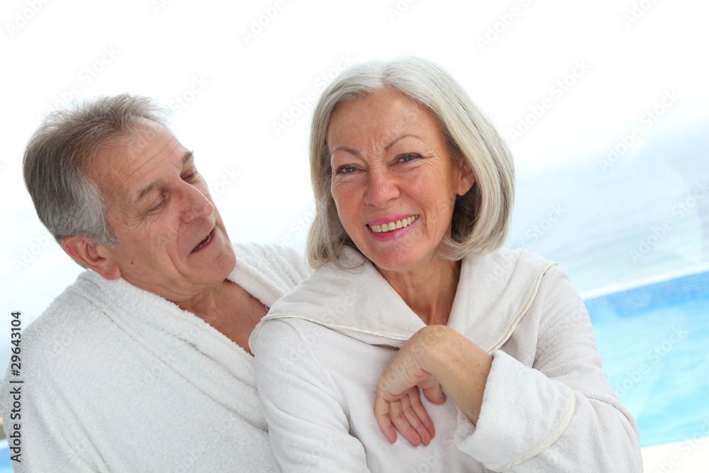 Portrait of happy senior couple in spa center