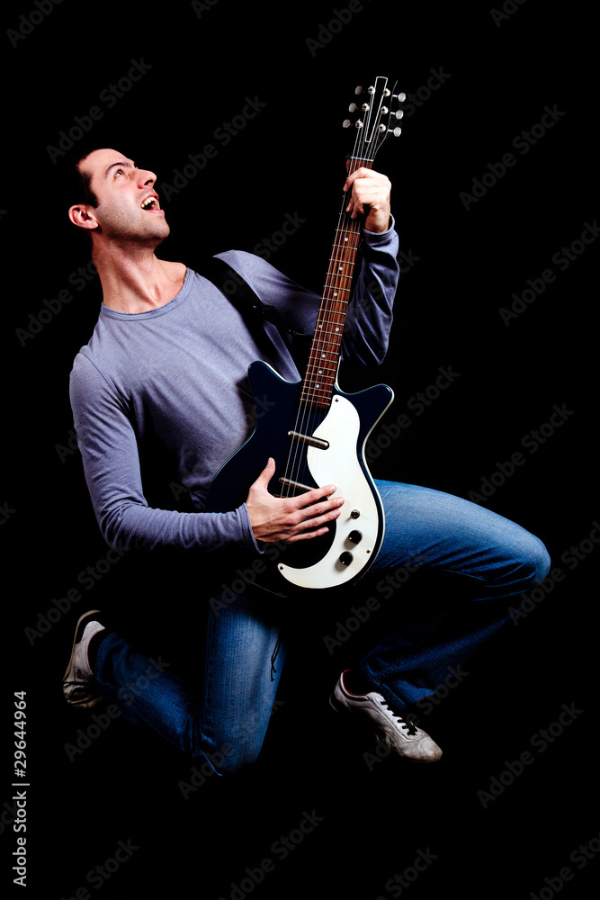 Fototapeta premium Crazy guitarist isolated on black