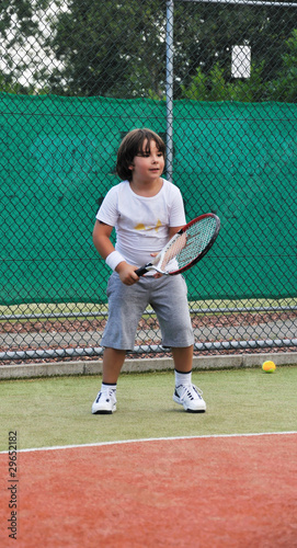 Young boy play tennis © cirkoglu