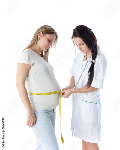 Pregnant woman and doctor.