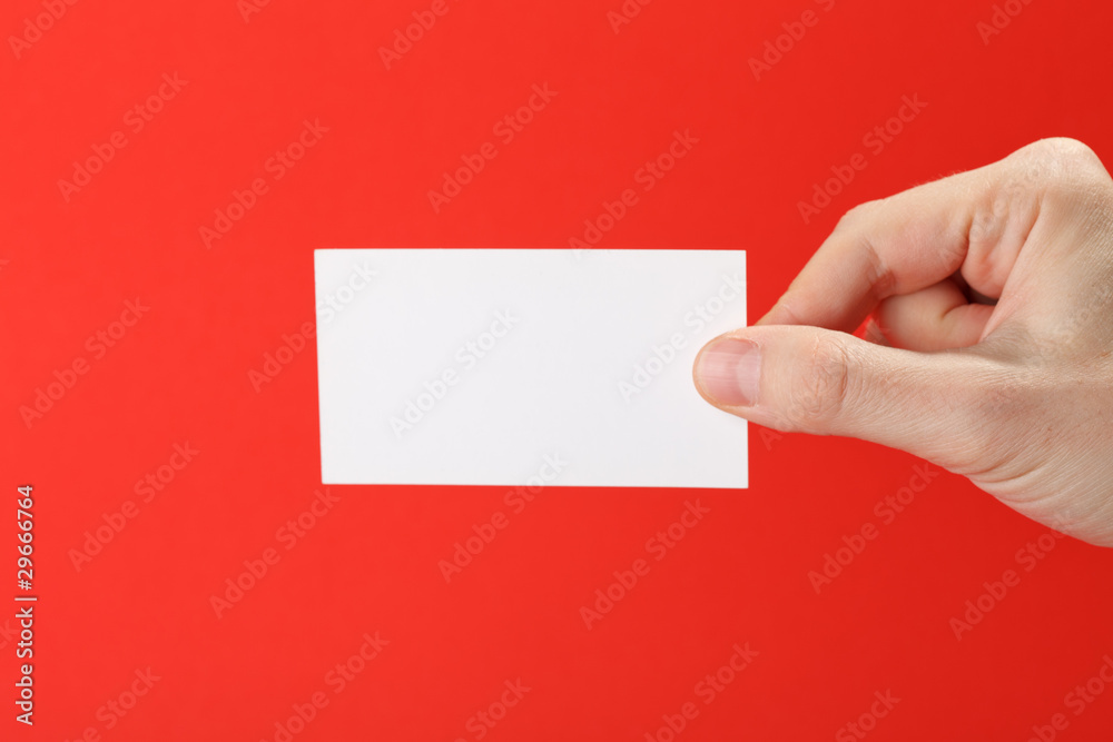 Obraz premium businessman's hand holding blank white paper business card