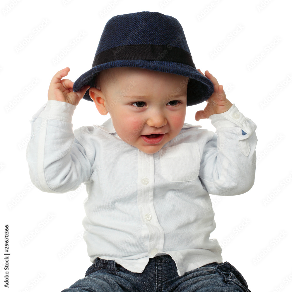 Beautiful baby boy posing with hat isolated on white Beautiful baby boy posing with hat isolated on white