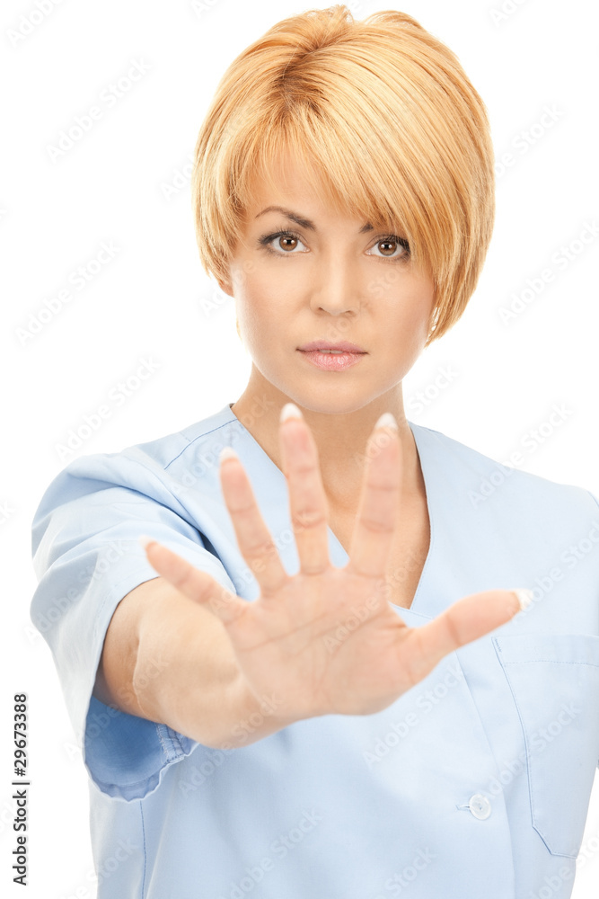 attractive female doctor showing stop gesture attractive female doctor showing stop gesture