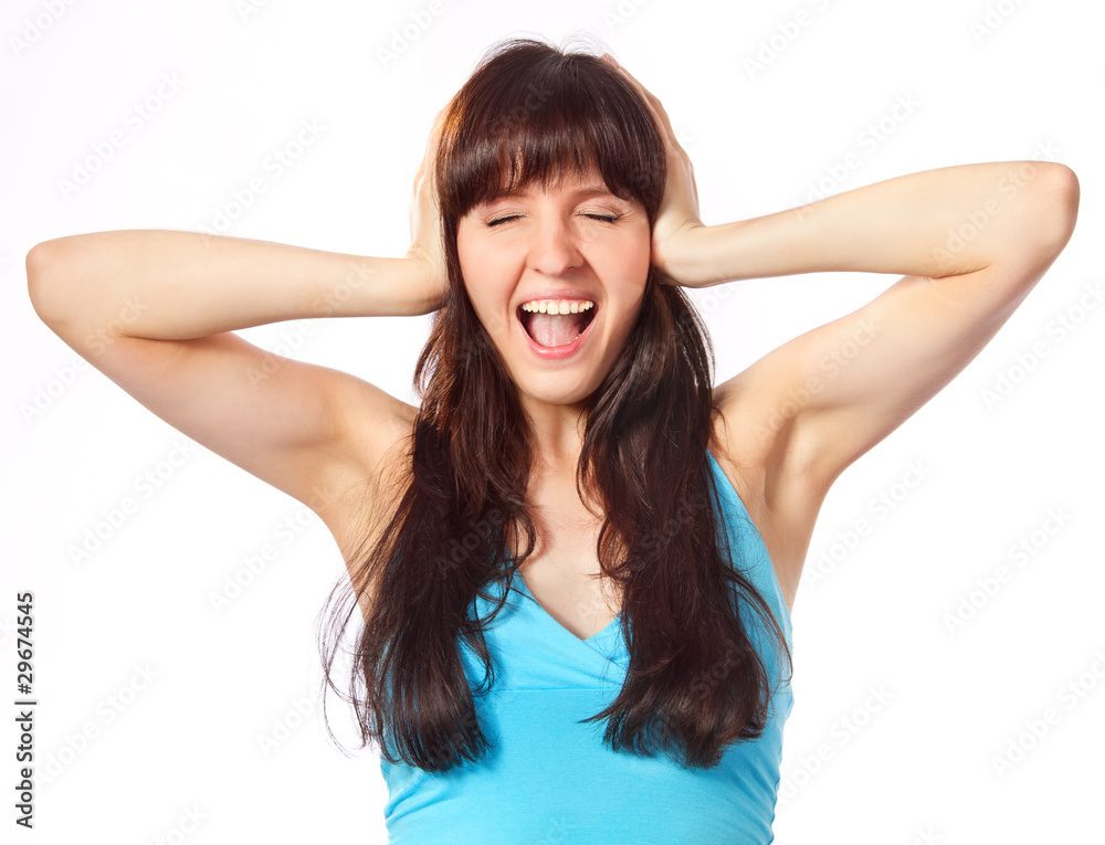 Screaming young woman holding head