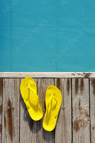 Sandals by a swimming pool