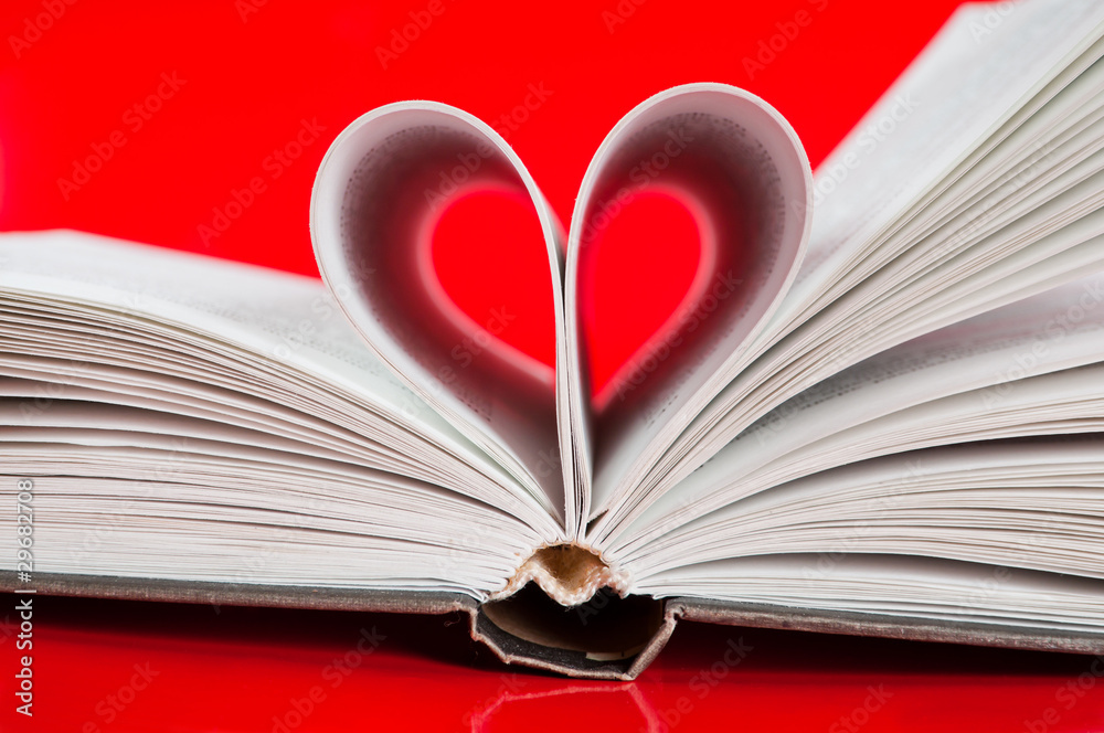 pages of a book curved into a heart shape pages of a book curved into a heart shape