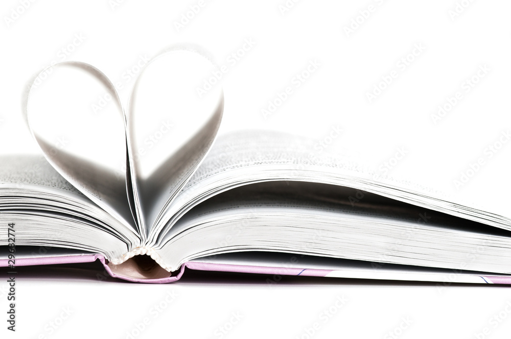pages of a book curved into a heart shape pages of a book curved into a heart shape
