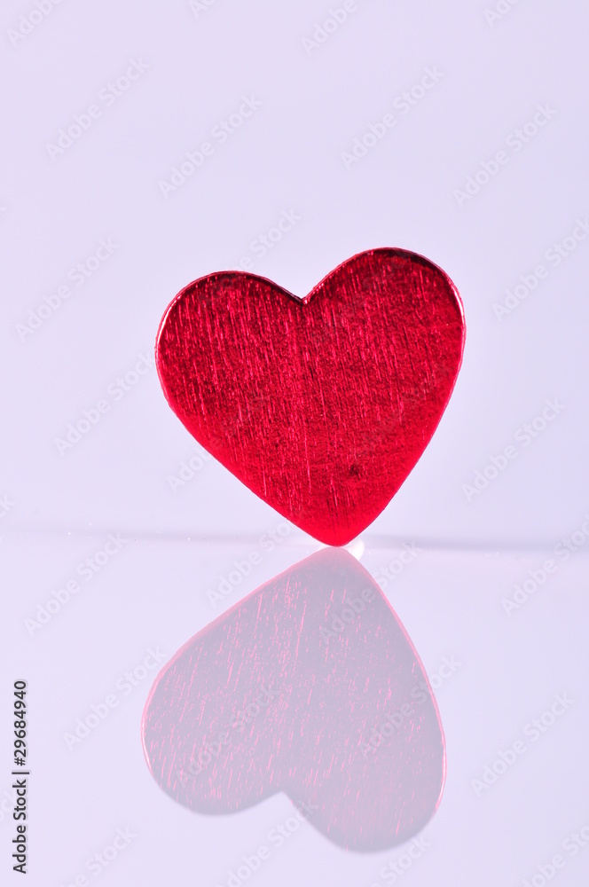 red heart on white with reflection