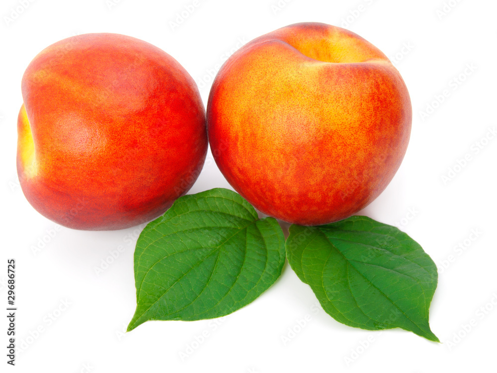 Ripe peach with leaves on a white background Ripe peach with leaves on a white background