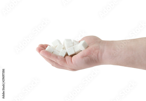 White sugar in hand isolated on white