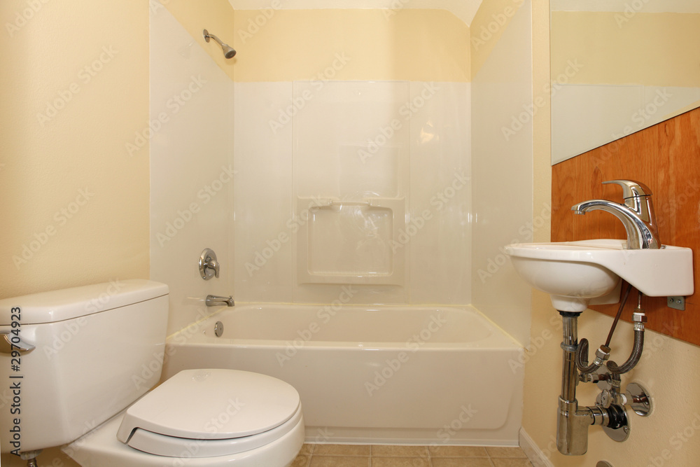 Simple bedroom with plastic tub and tiny sink Simple bedroom with plastic tub and tiny sink