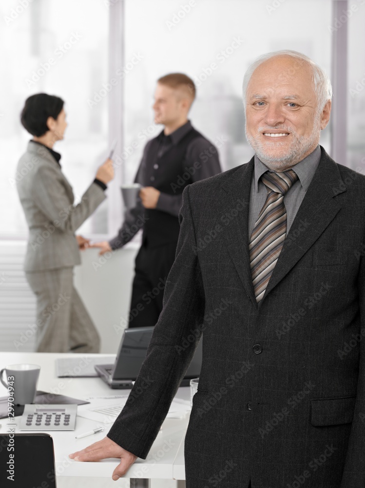 Portrait of proud senior executive in office Portrait of proud senior executive in office
