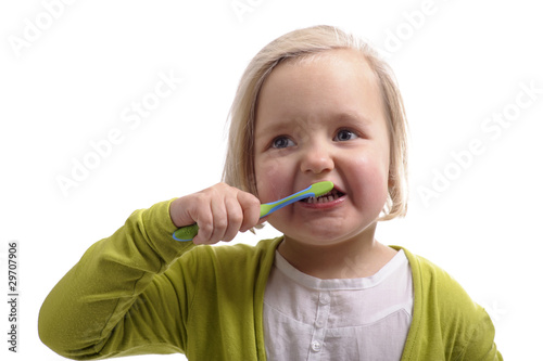 little girl washing her teeth