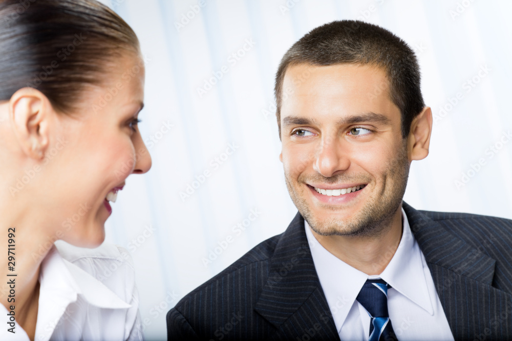 Two businesspeople, or businessman and client, at office Two businesspeople, or businessman and client, at office