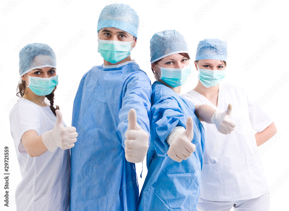 medical team showing thumbs up medical team showing thumbs up