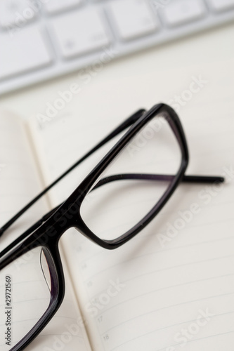 Glasses and keyboard