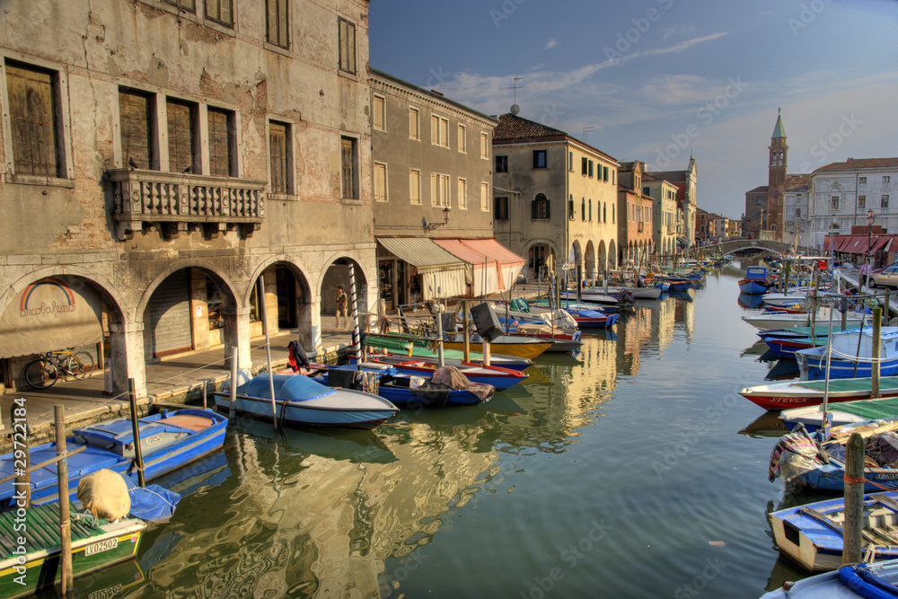Chioggia channel with bell tower and boats