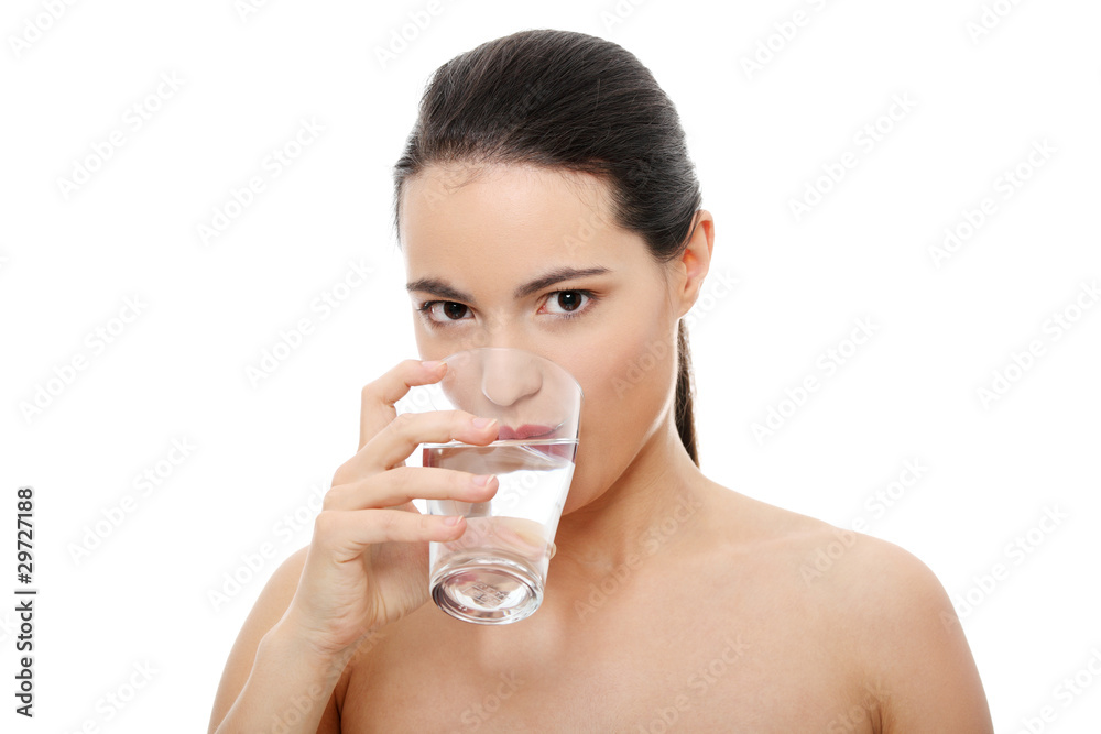 Beautiful young woman drinks clear mineral water Beautiful young woman drinks clear mineral water