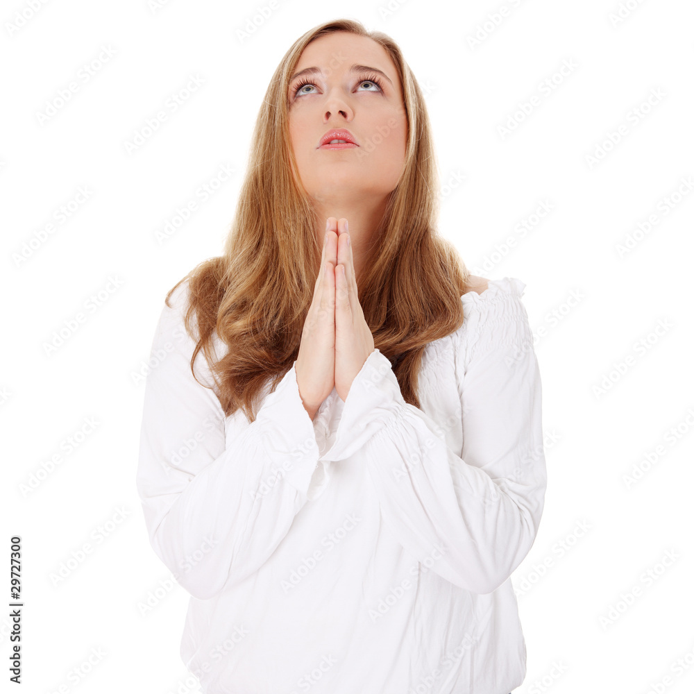 Closeup portrait of a young caucasian woman praying Closeup portrait of a young caucasian woman praying