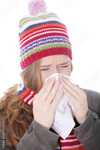 Sneezing woman with handkerchief