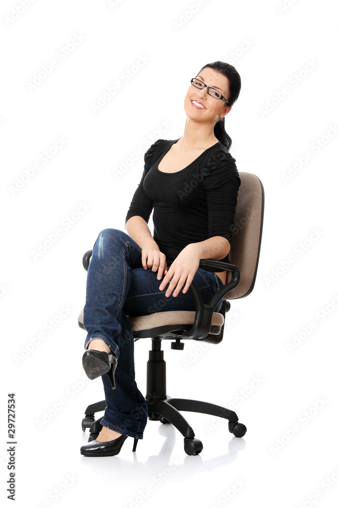 Fototapeta premium Young happy woman sitting on a wheel chair
