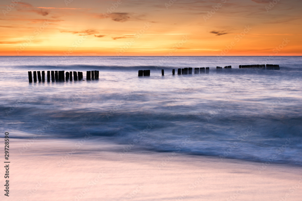 Groyne at dusk in Ustronie Morskie