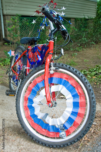 Children bike decorated in american flags prepared for 4th July