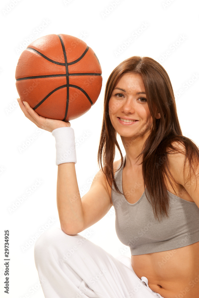 Pretty brunette woman holding Basketball in hand Pretty brunette woman holding Basketball in hand
