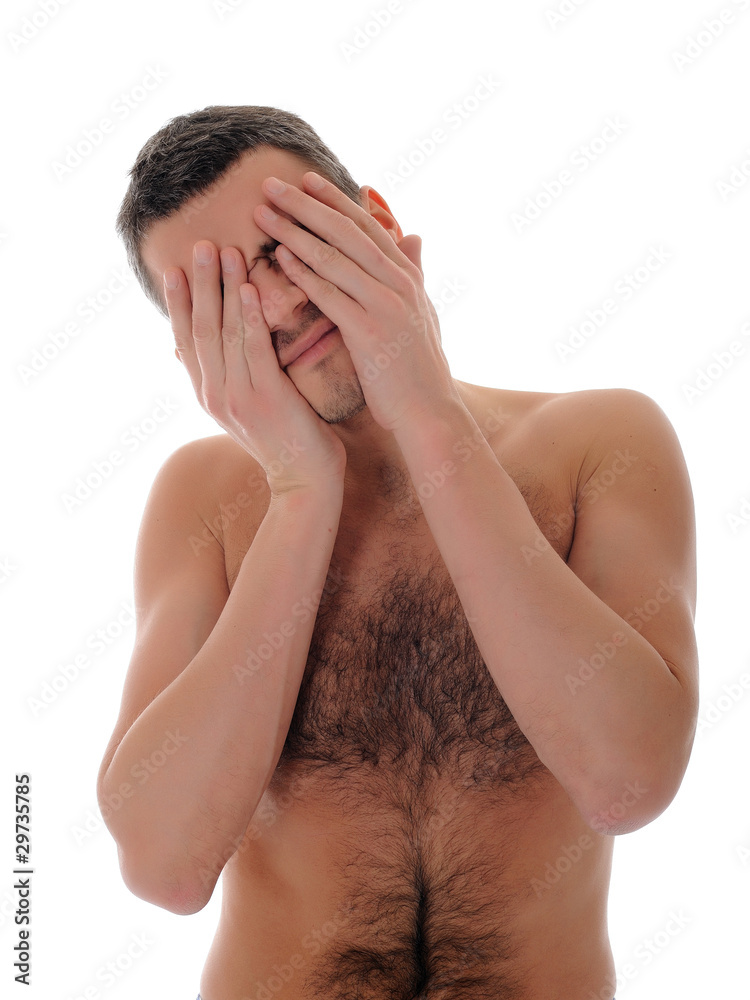 Fototapeta premium Young handsome man closed his eyes with hands. isolated on white