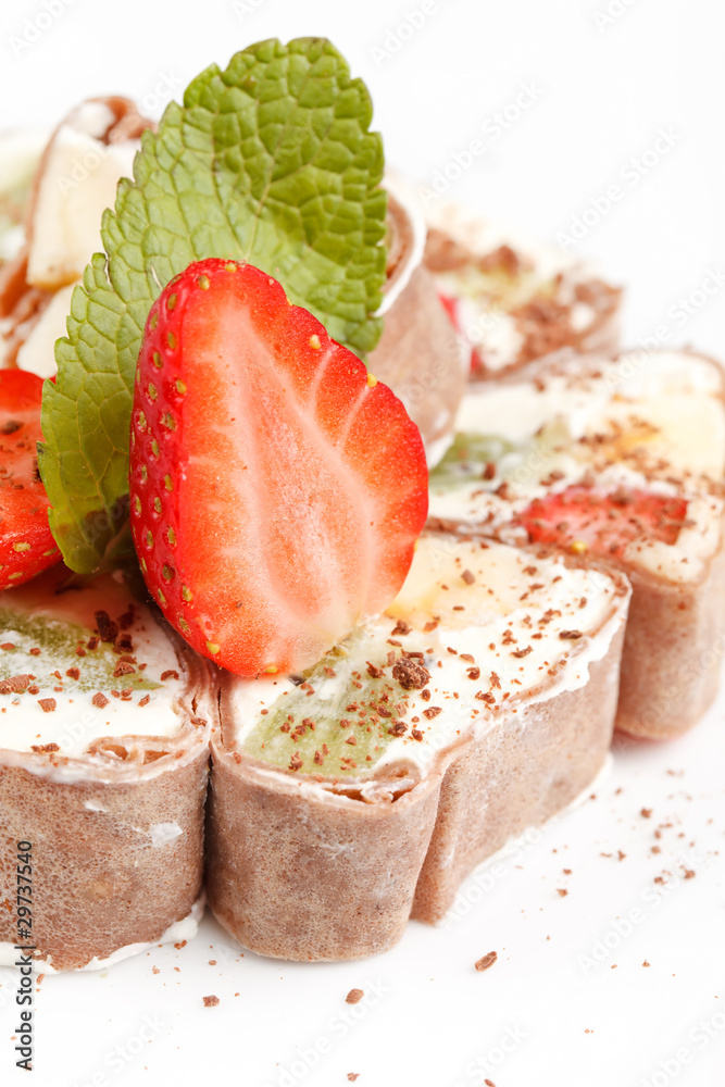 Tiramisu Sushi Roll garnished with Strawberry and Mint Tiramisu Sushi Roll garnished with Strawberry and Mint