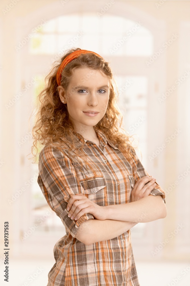 Portrait of pretty young girl at home smiling