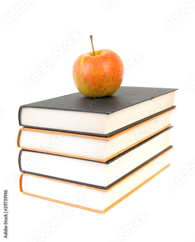 back to school: stack of books with apple on top
