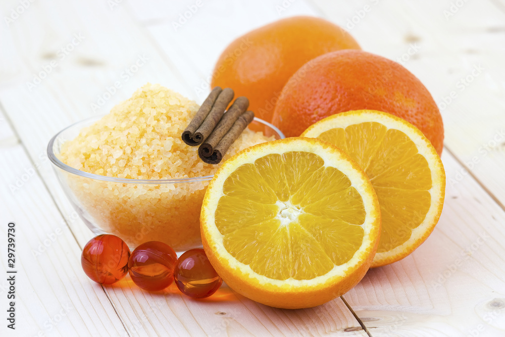 bowl of orange bath salt with fresh fruits - beauty treatment bowl of orange bath salt with fresh fruits - beauty treatment