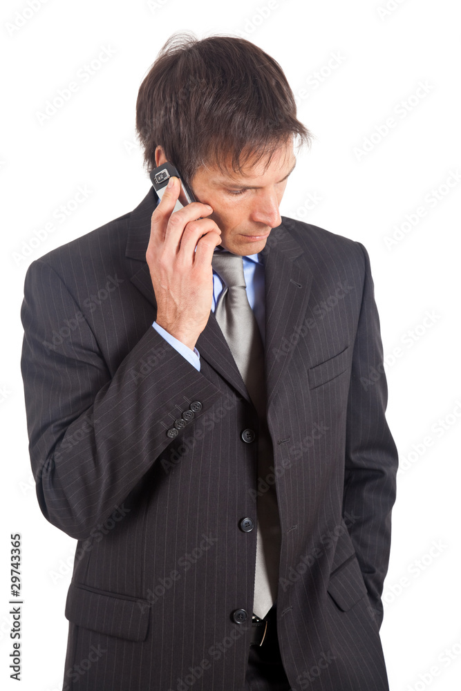 Thoughtful mature businessman talking on the phone Thoughtful mature businessman talking on the phone