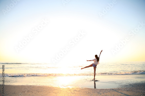 Young girl enjoys summer day at the beach.