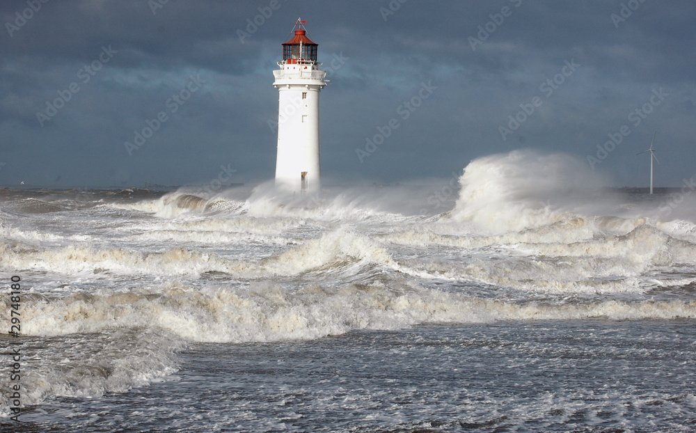 Waves ride up against New Brighton Lighthouse