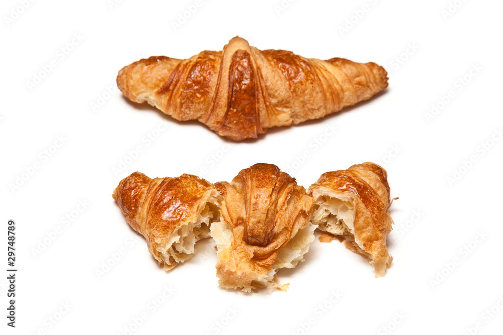 Butter Croissant isolated on a white studio background. Butter Croissant isolated on a white studio background.