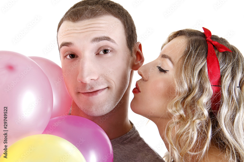 beautiful girl kissing a boy with a baloons beautiful girl kissing a boy with a baloons