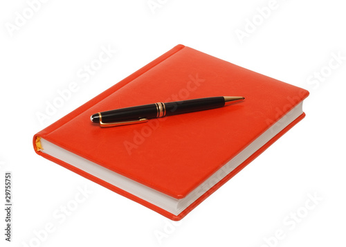 Orange diary and black pen on a white background .