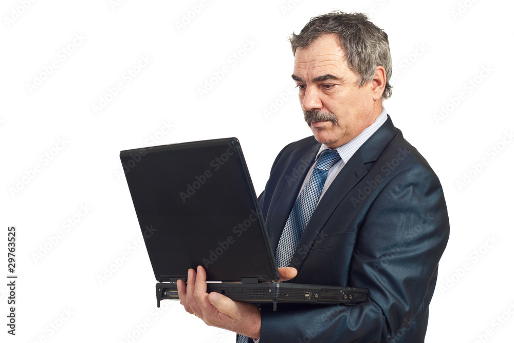 Serious mature manager work on laptop Serious mature manager work on laptop