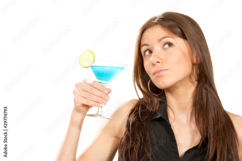Brunette woman holding popular blue tropical martini cocktail Brunette woman holding popular blue tropical martini cocktail