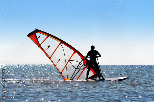 Windsurfer picks up the sail