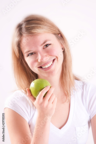 Beautiful woman eating an apple