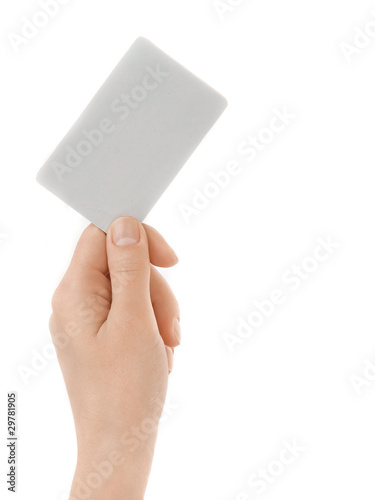 Business card in female hand. Studio isolated.