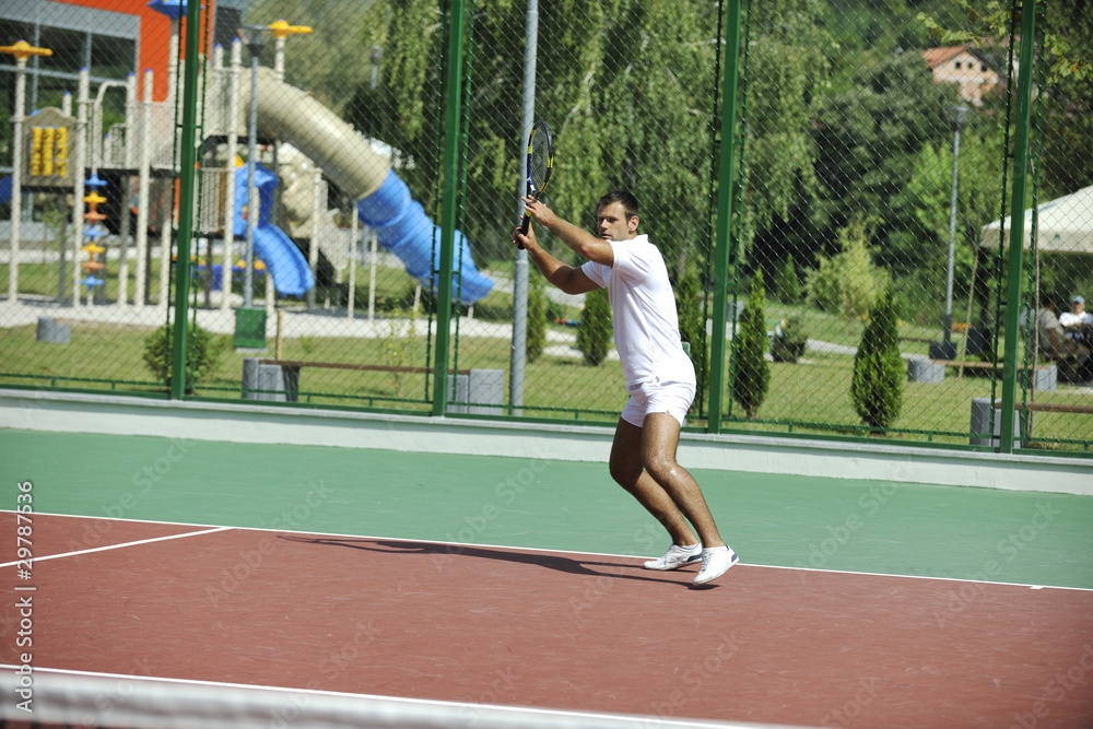 young man play tennis outdoor