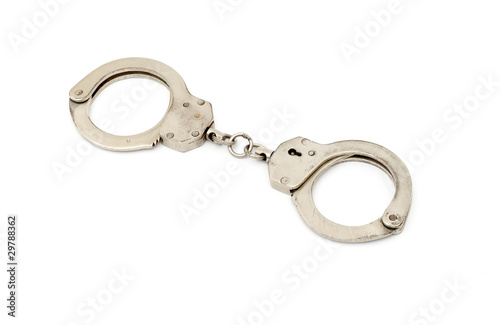 steel metallic handcuffs (manacles) isolated on white background