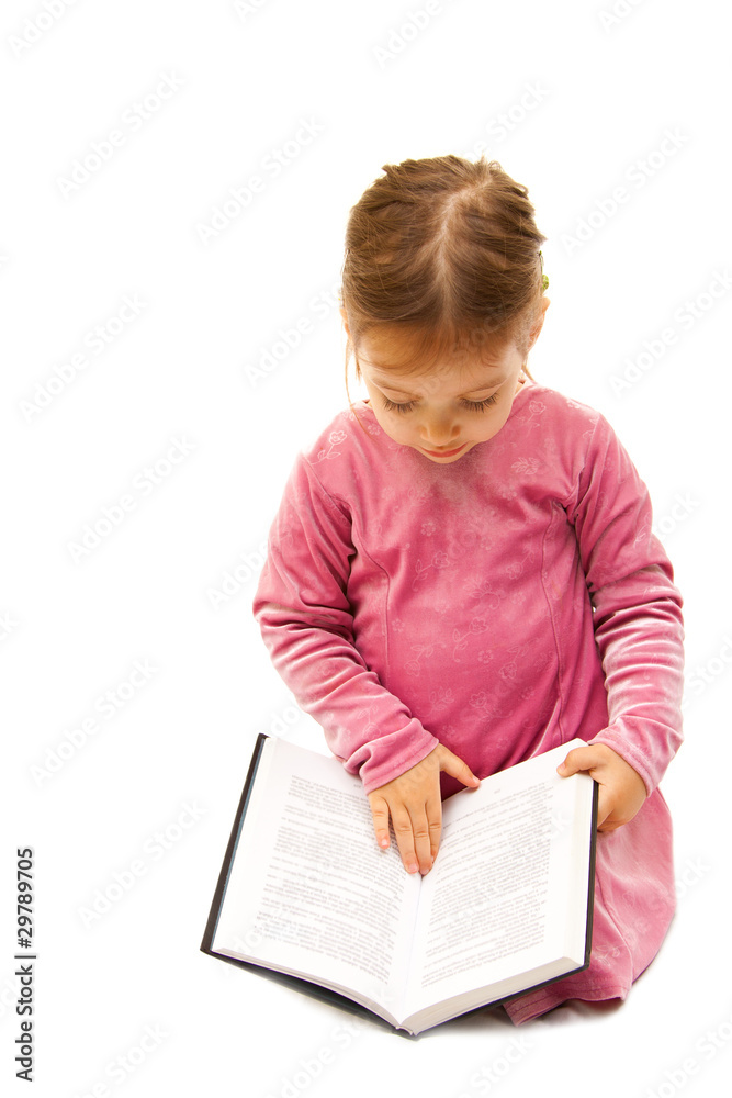 cute little preschool girl reading a book cute little preschool girl reading a book