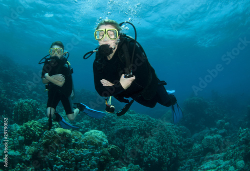 mother and son scuba dive together